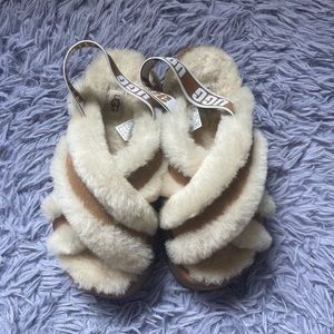 UGG slippers with hard bottom. Size 7 with a strap in the back. Color chestnut